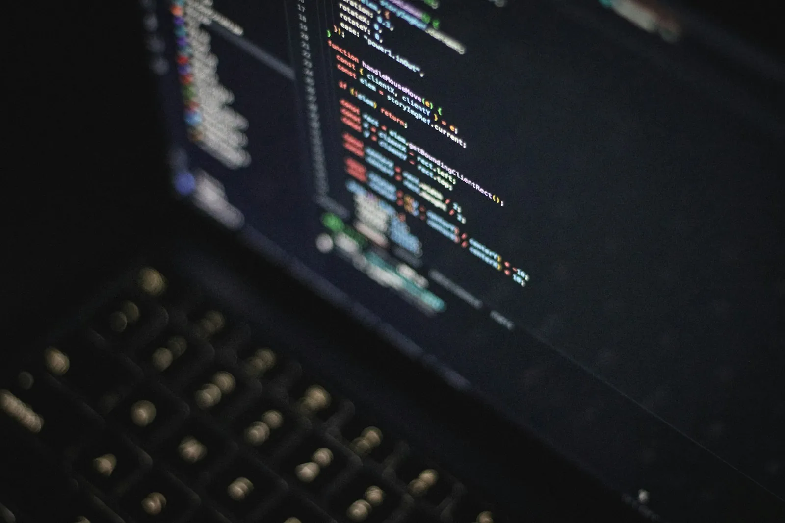 Colourful code on a laptop screen at night, learning to code from a non-CS background