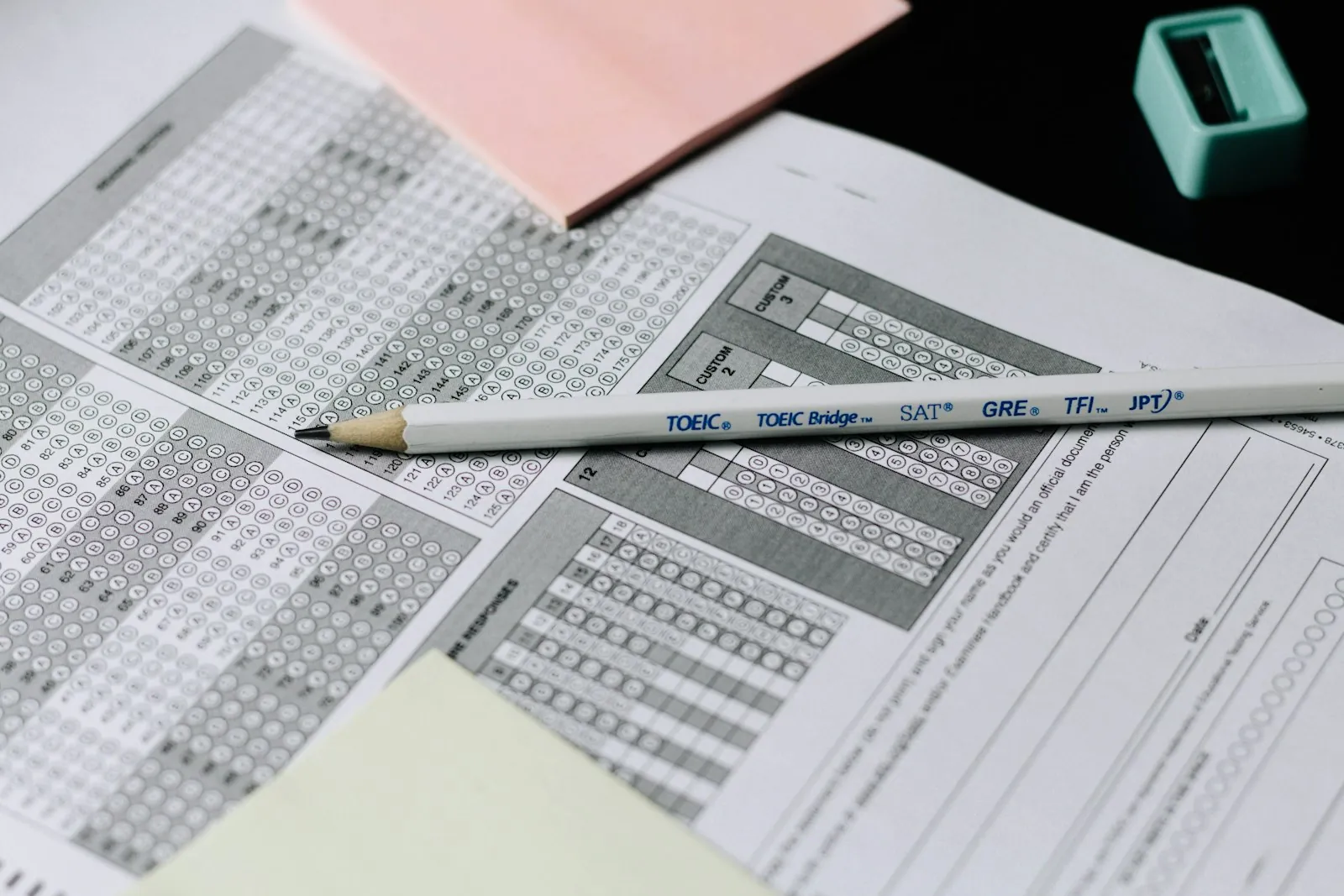 A pencil resting on a multiple-choice exam answer sheet