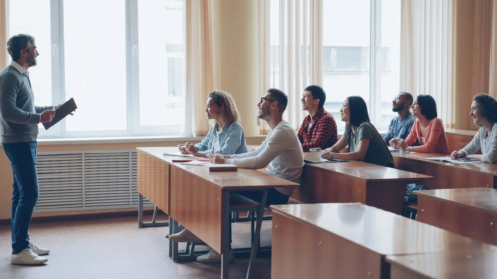 A teacher lecturing a classroom of students, which is what a paid training course looks like
