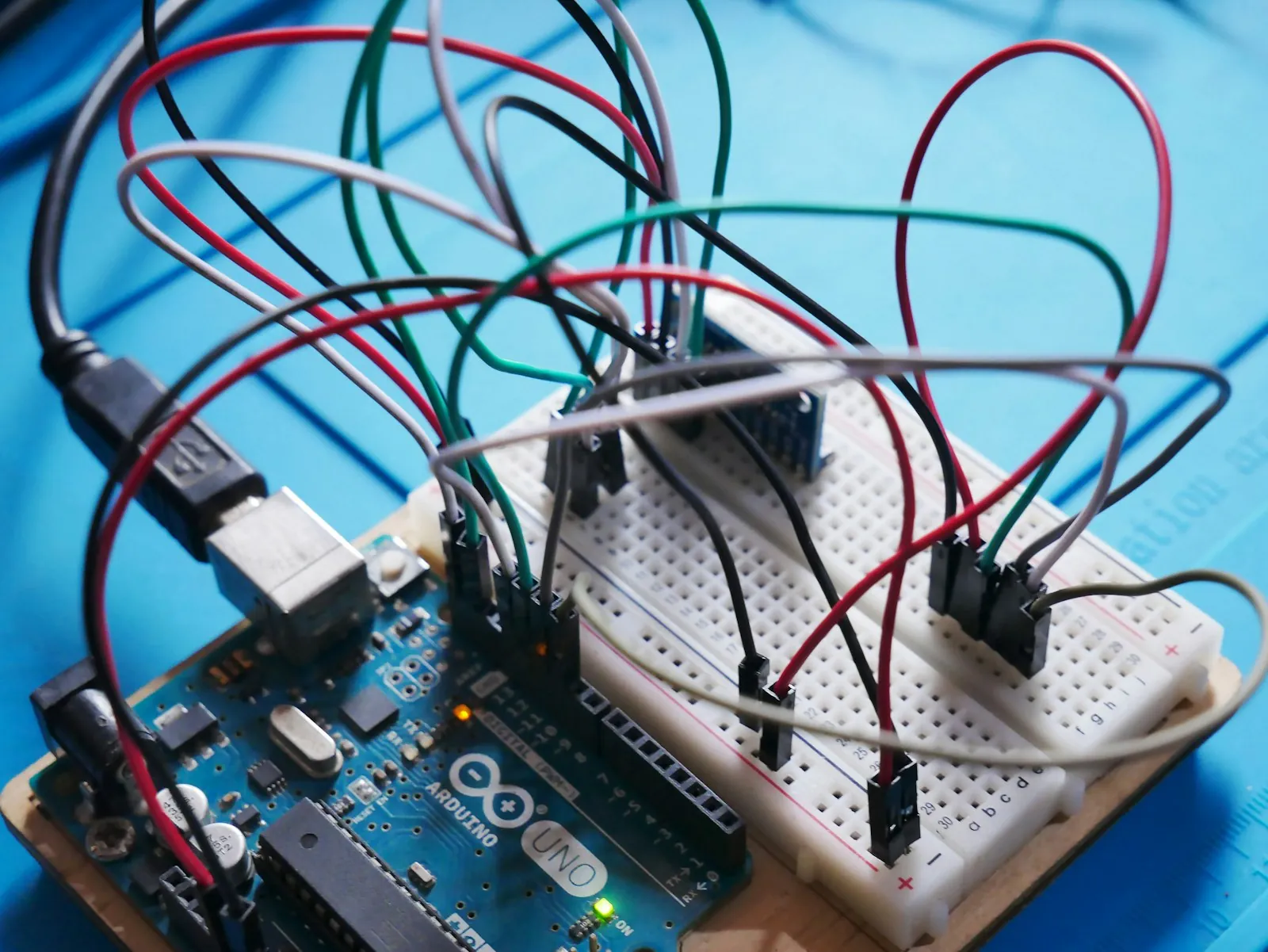Arduino board wired to sensors on a solderless breadboard, the classic hardware prototyping setup